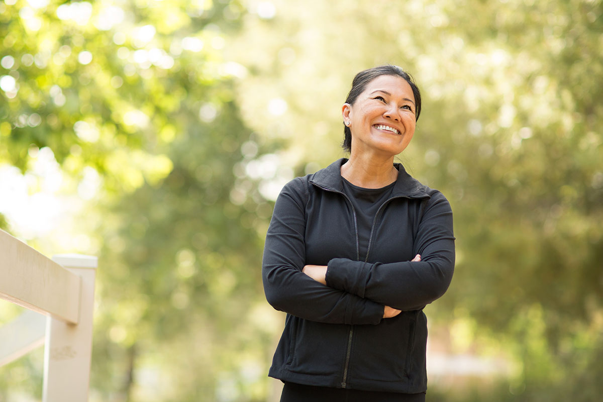 Portrait of a fit Asian woman exercising outside.