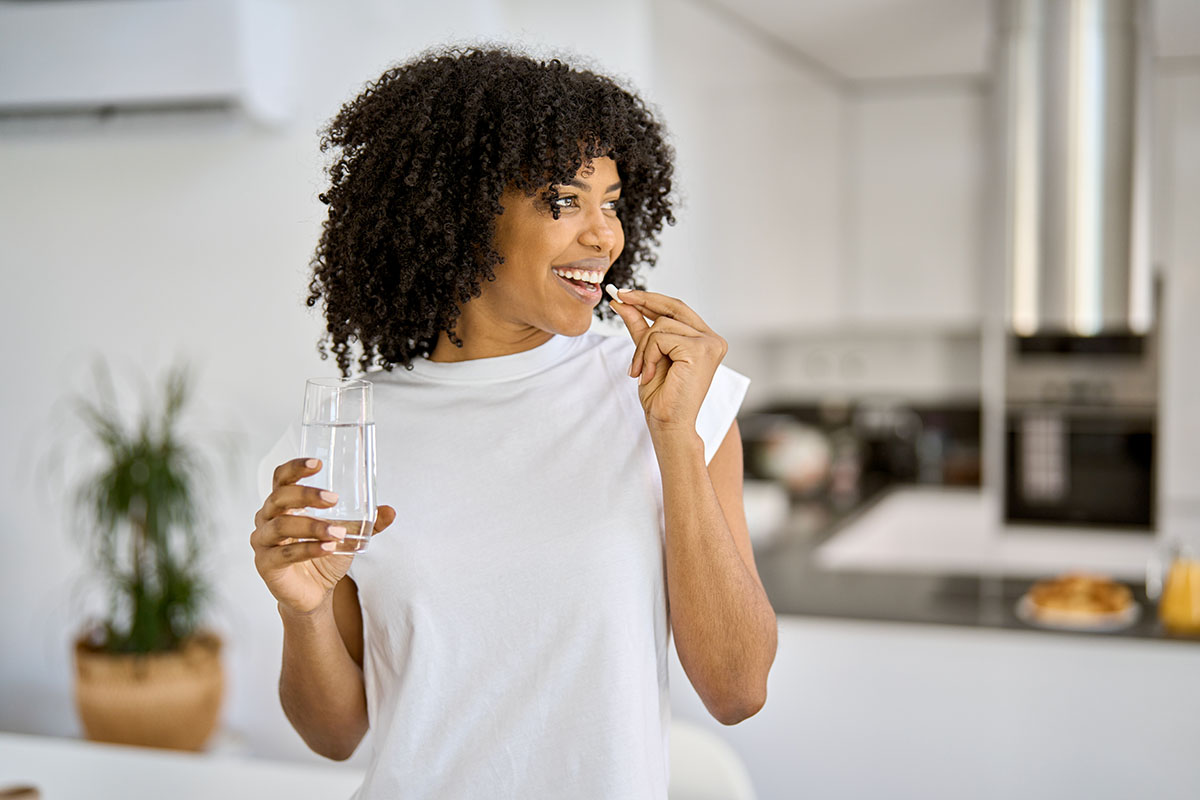 Woman taking vitamins