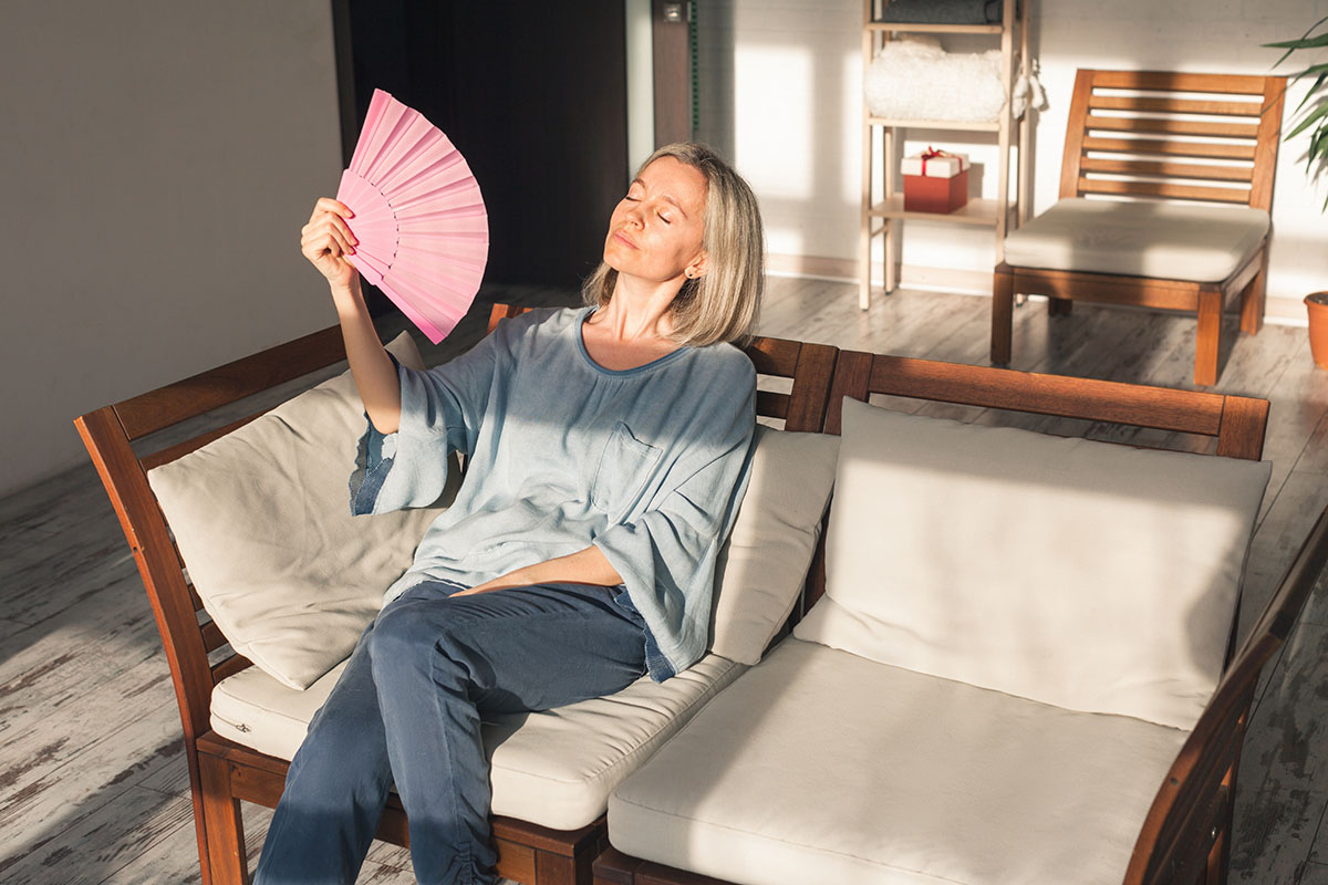 woman waving pink fan