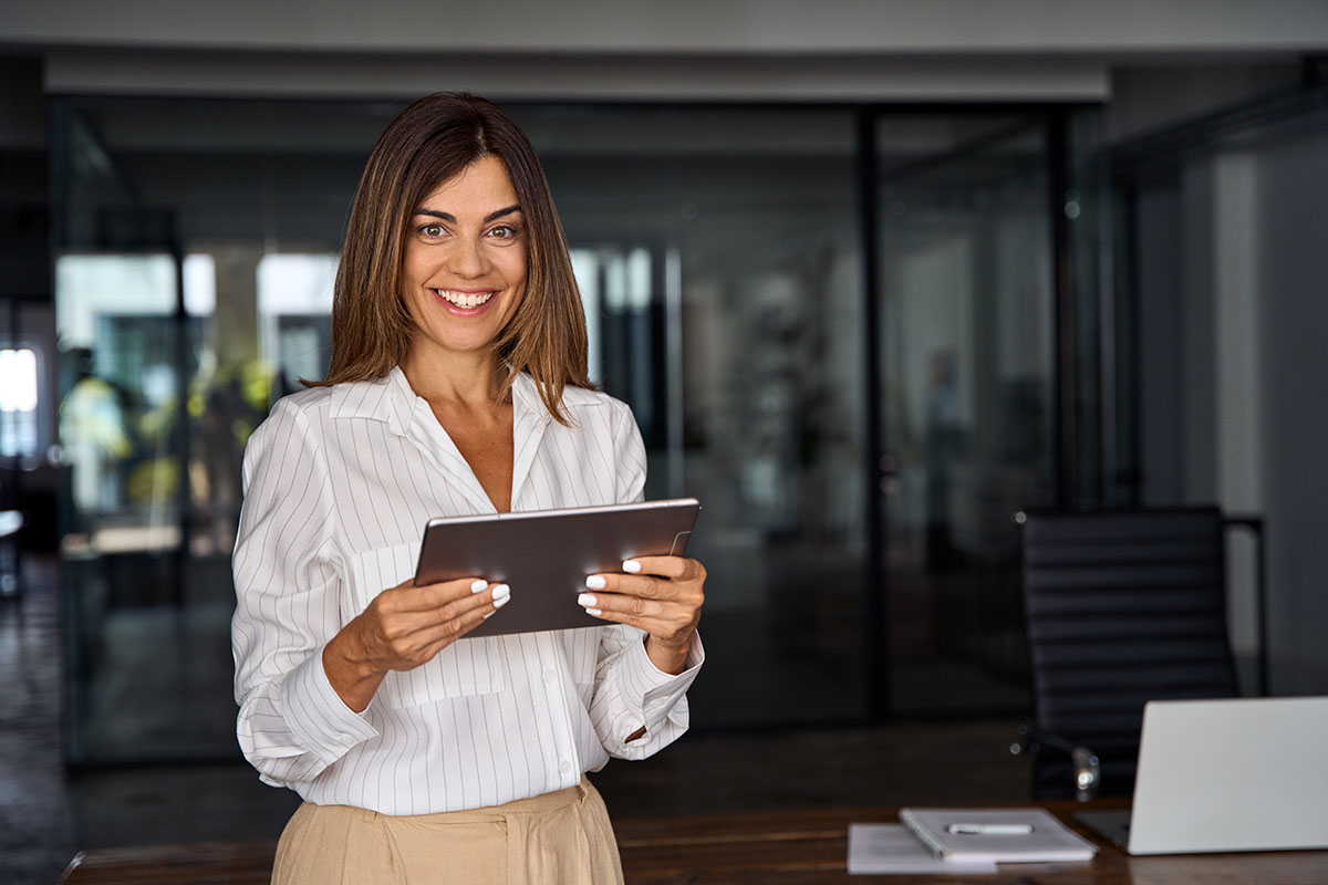 mature business woman looking at camera. smiling 