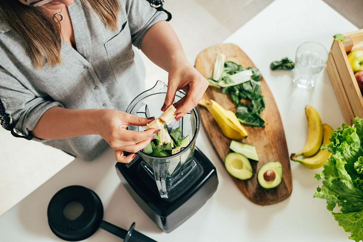 Woman preparing a smoothie