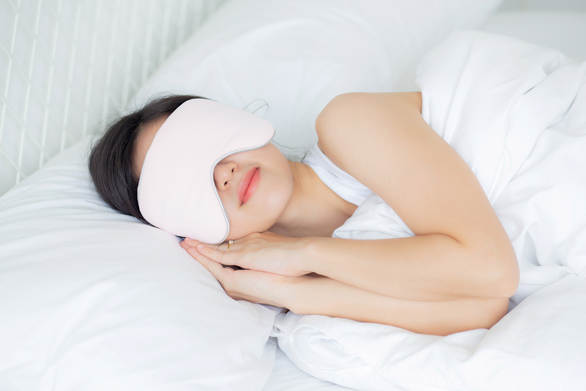 woman sleeping with eye mask