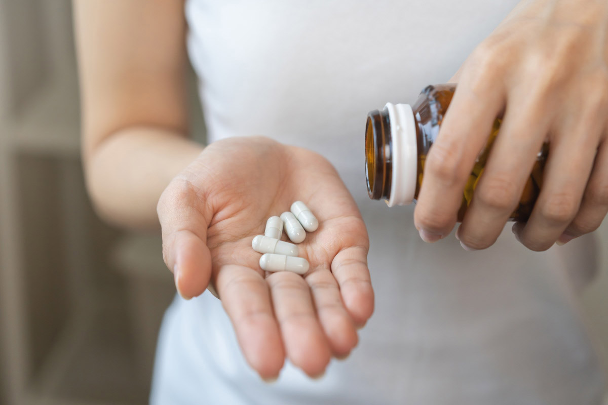 Capsules in woman's hand